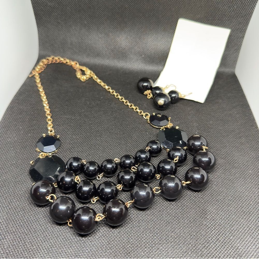 Black multi strand necklace with matching earrings
